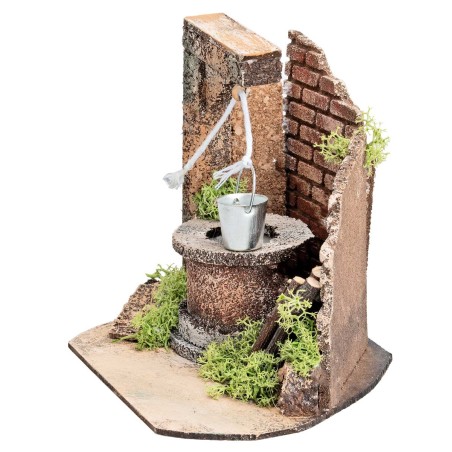 Pozo con cubo y muro lateral de ladrillos para estatuas