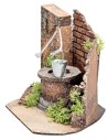 Well with bucket and side brick wall for statues from