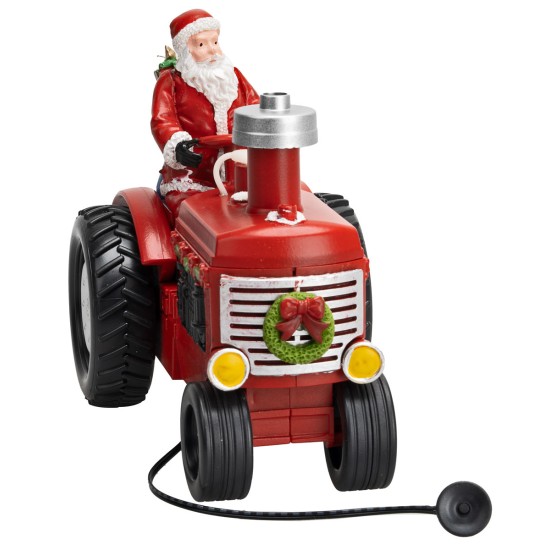 Santa Claus on the tractor with gift packages complete with