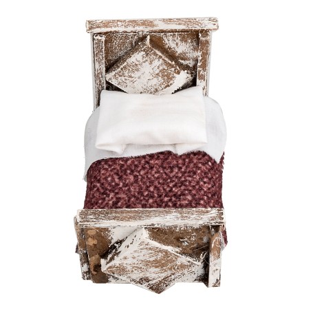 Letto con coperta in legno cm 6,5x4x5,3h per presepe Mondo