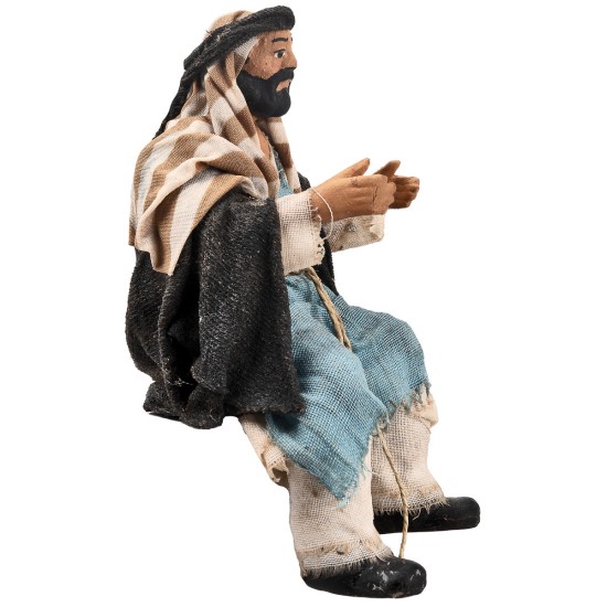 Seated man series 15 cm in terracotta with fabric clothes for