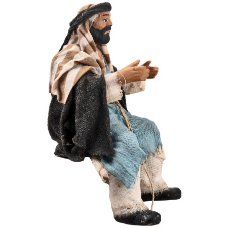 Seated man series 15 cm in terracotta with fabric clothes for