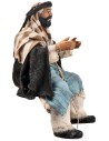 Seated man series 15 cm in terracotta with fabric clothes