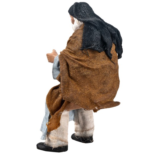 Uomo palestinese seduto serie 15 cm in terracotta con abiti in