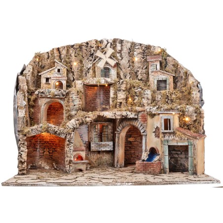 Handcrafted nativity scene with moving mill, stream, and oven