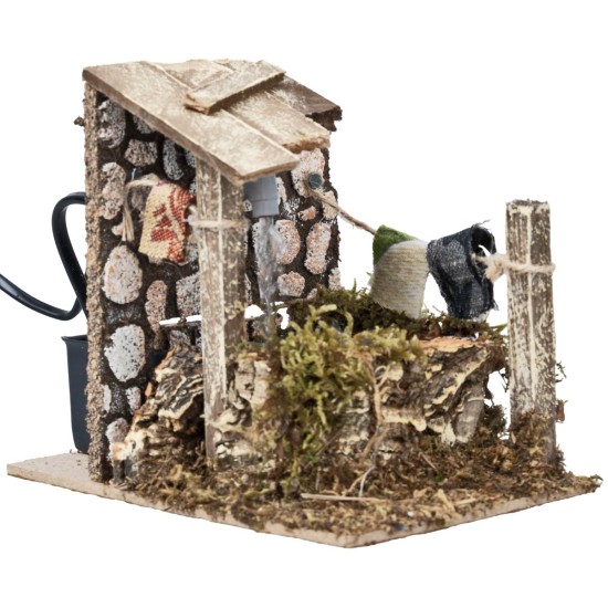 Fuente con chorro y bomba funcionando con corriente cm