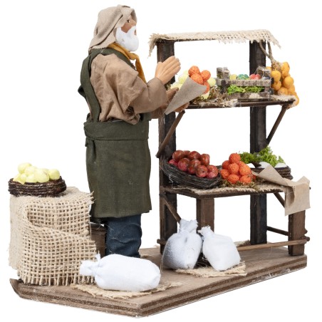 Fruttivendolo con banco h 17 cm in movimento per presepe Mondo