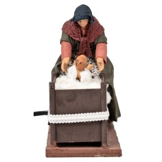 Mujer con niño en la cuna con doble movimiento serie 14 cm 2