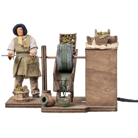 Woman grinding olives in motion series 12 cm for nativity scene