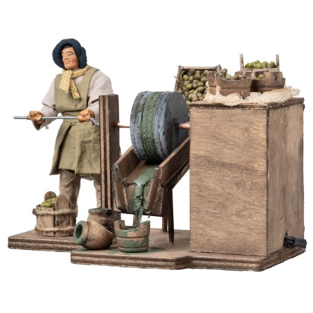 Hombre que muele aceitunas en movimiento serie 12 cm