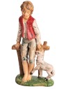 Boy sitting on fence with little sheep h 18 cm for nativity scene