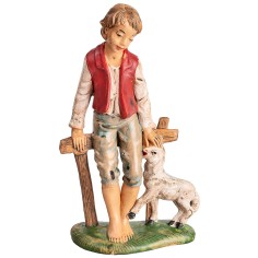 Boy sitting on fence with little sheep h 18 cm for nativity scene