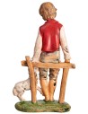 Boy sitting on fence with little sheep h 18 cm for nativity scene