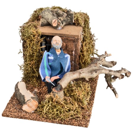 Lumberjack cutting 12 cm tree in motion for nativity scene