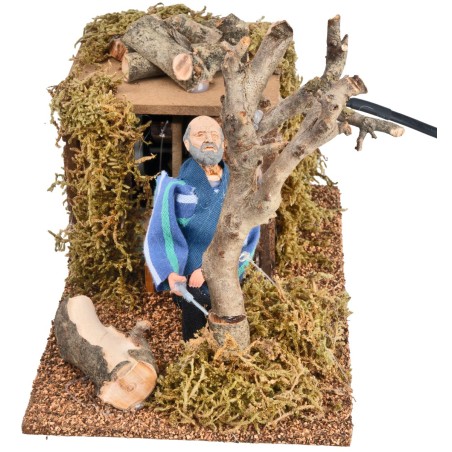 Lumberjack cutting 12 cm tree in motion for nativity scene