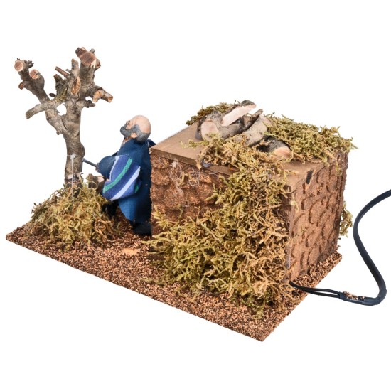 Boscaiolo che taglia albero 12 cm in movimento per presepe