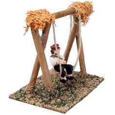Bambino sull'altalena h 10 cm per presepe Mondo Presepi 2