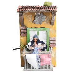 Woman on the balcony hanging clothes 10 cm in motion