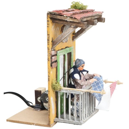 Signora che stende 10 cm in movimento per presepe Mondo Presepi