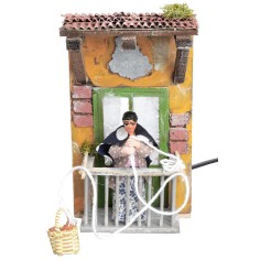 Woman on balcony with basket 10 cm moving for nativity scene