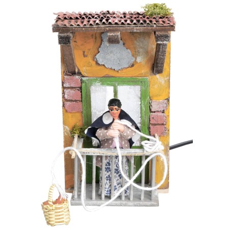 Woman on balcony with basket 10 cm moving for nativity scene