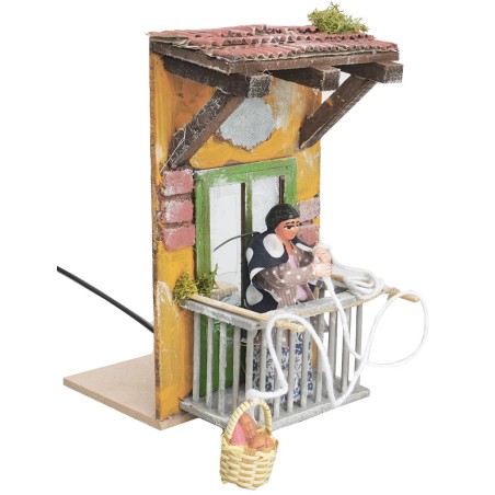 Woman on balcony with basket 10 cm moving for nativity scene
