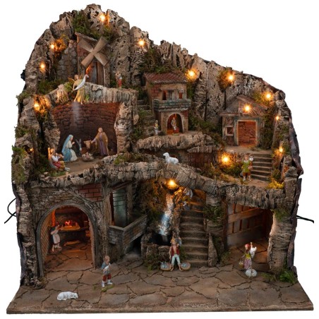 Presepe illuminato con statue, ruscello, forno e mulino a vento