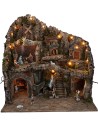 Presepe illuminato con statue, ruscello, forno e mulino a vento