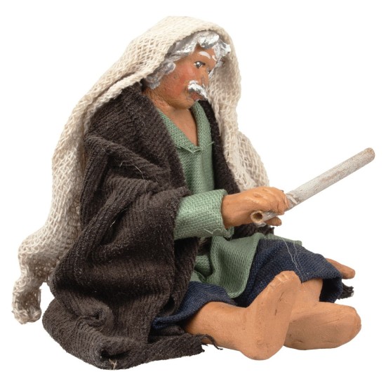 Hombre sentado avivando el fuego serie 12 cm para belén Mundo