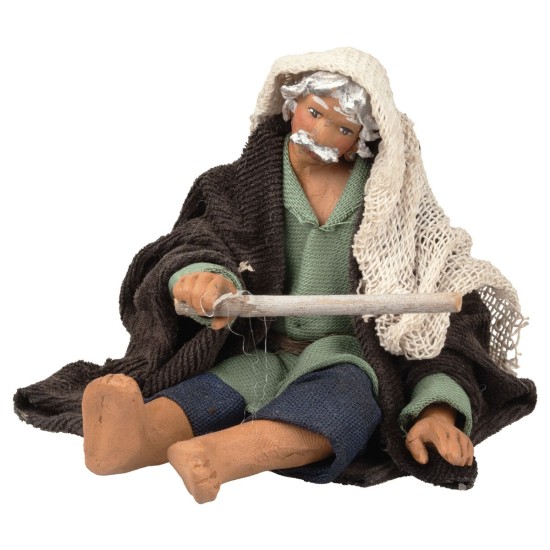 Hombre sentado avivando el fuego serie 12 cm para belén Mundo