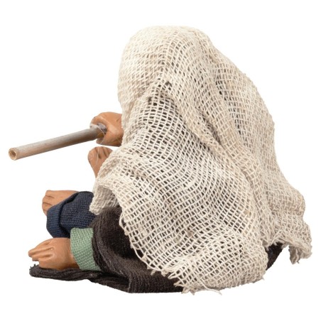 Hombre sentado avivando el fuego serie 12 cm para belén Mondo