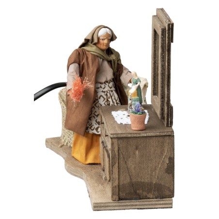 Donna che spolvera la credenza in movimento serie 12 cm