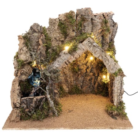 Illuminated nativity scene with cork bark hut and