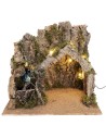 Illuminated nativity scene with stable made of cork bark and