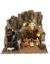 Illuminated nativity scene with stable made of cork bark and