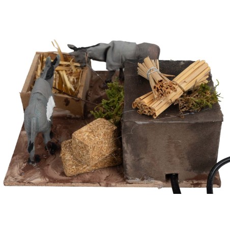 Pair of donkeys at the manger with double movement for nativity