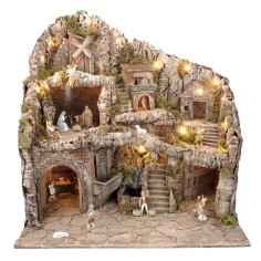Presepe illuminato con statue, ruscello, forno e