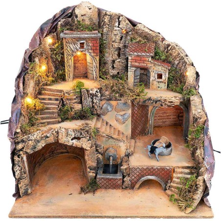 Presepe illuminato con fontana e asino alla