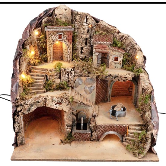 Presepe illuminato con fontana e asino alla