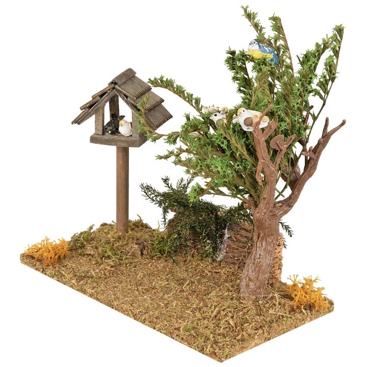 Pradera con casita y árbol con pájaros
