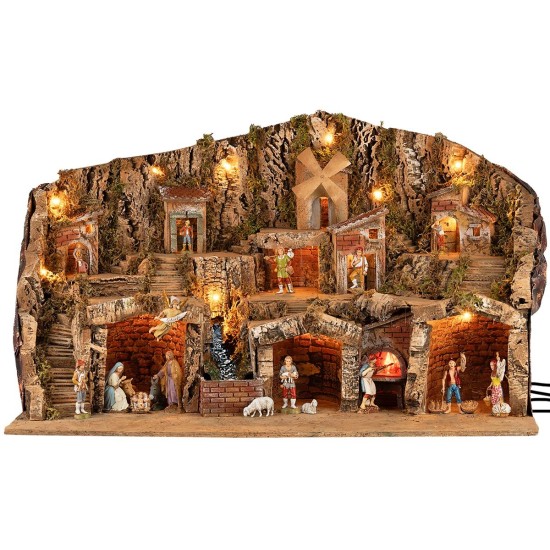 Pesebre iluminado con cuevas, casitas, arroyo