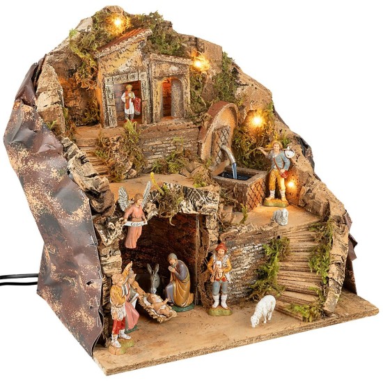 Illuminated nativity scene with fountain and