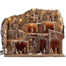 Illuminated nativity scene with fountain and