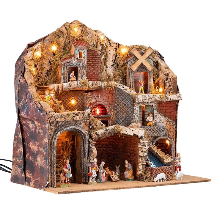 Pesebre con estatuas Landi iluminado con horno