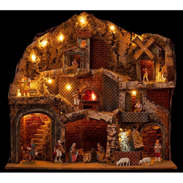 Pesebre con estatuas Landi iluminado con horno