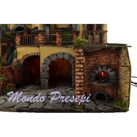 The crib with the village lit up with a waterfall, 60x40