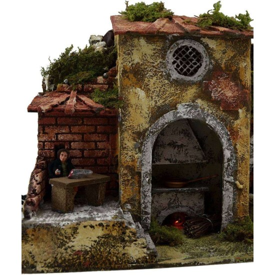 Uomo al tavolo in movimento con fuoco, fontana e luci Mondo