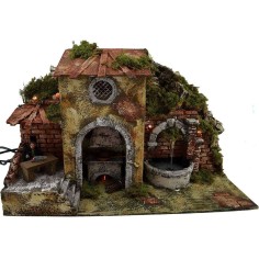 Man at the table in motion with fire, fountain and lights