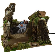 Hombre que descansa en hamaca en movimiento Mundo Pesebres